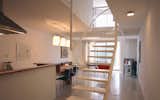 Floating stair with hanging handrail