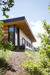 Exterior, House Building Type, Metal Roof Material, Wood Siding Material, Shed RoofLine, and Flat RoofLine Paths from the house connect to nearby hiking trails for outdoor and wildlife experiences.  Photos from Red Hawk