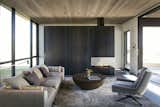A free standing, three-sided fireplace bookends the living room creating entry and privacy for the master bedroom.