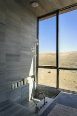 A recessed master tub views the rolling golden hills of the Bear River mountain range.