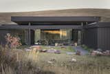 The central court yard is flanked on three sides by free standing structures connected by a floating canopy, giving the outdoor living space protection from wind and weather.