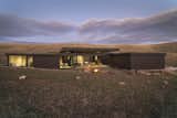 Nature is allowed to permeate the building site giving the impression that the retreat grew out of the ground rather than placed upon it.