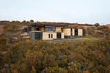 The south elevation rises above the gambrel oak to let in stunning views and winter sun.