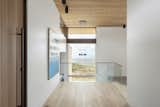 Upon entry guests get an initial framed peek of the home's stunning views.