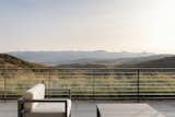 Native grasses planted along the rooftop's perimeter soften the edge between architecture and view.