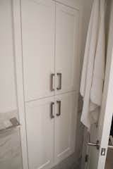 MASTER BATHROOM CUSTOM BUILT-IN STORAGE- CONTEMPORARY NYC RENOVATION: What does every tiny bathroom need? Storage! We were able to carve out a built in cabinet behind the door of this compact jewel of a bath.