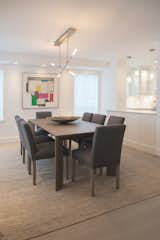 OPEN DINING ROOM - CONTEMPORARY NYC RENOVATION: By maximizing on lighting and layout we create a uninterrupted flow between kitchen and dining areas for entertaining and every day living in this NYC dream apartment. The expansiveness of the cerused European white oak floors is a gorgeous visual anchor throughout the open floor plan.