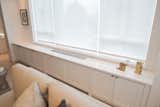 CUSTOM BUILT-IN PTAC - CONTEMPORARY NYC RENOVATION: Custom built-in radiator covers and storage cabinets throughout the apartment seamlessly, and elegantly hide the all new heating / cooling units and building mechanicals while providing great organization options.