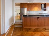 Modern Oak Kitchen that required opening the adjoining wall to incorporate a huge kitchen with a 12 foot island and  sunken Dining room on the Studio side.