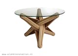 "LOCK" coffee table is designed out of the qualities, possibilities and characteristics of its highly sustainable material: BAMBOO. The frame is build up from layers of flexible bamboo. The layers are pressed together. The shape is formed by the bamboo's natural bending curve. The layers of bamboo curve through each other and entwine, locking each other in place.