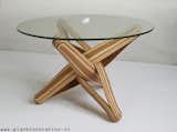 "LOCK" coffee table is designed out of the qualities, possibilities and characteristics of its highly sustainable material: BAMBOO. The frame is build up from layers of flexible bamboo. The layers are pressed together. The shape is formed by the bamboo's natural bending curve. The layers of bamboo curve through each other and entwine, locking each other in place.