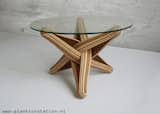"LOCK" coffee table is designed out of the qualities, possibilities and characteristics of its highly sustainable material: BAMBOO. The frame is build up from layers of flexible bamboo. The layers are pressed together. The shape is formed by the bamboo's natural bending curve. The layers of bamboo curve through each other and entwine, locking each other in place.