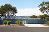 Like many Eichlers, the public right-of-way facade is shy and private