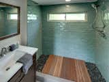 Bathroom with sea green tiles and Abaco flooring