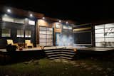 Exterior, Metal Roof Material, Metal Siding Material, and Wood Siding Material "Amplified" Tiny House at Night  Photo 10 of 18 in Amplified Tiny House by Asha Mevlana