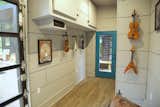 Office, Study Room Type, Storage, Shelves, and Light Hardwood Floor Inside soundproofed music studio  Photo 15 of 18 in Amplified Tiny House by Asha Mevlana