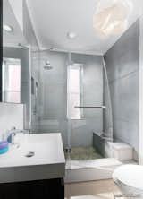 Bath Room, Wall Mount Sink, Concrete Floor, Corner Shower, Enclosed Shower, Pendant Lighting, One Piece Toilet, and Two Piece Toilet  Photo 7 of 11 in Johnson-Leeds Residence by GreyWall Development & Design 