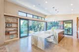 Kitchen, Marble Counter, Dishwasher, Wood Cabinet, Limestone Floor, Ceiling Lighting, Pendant Lighting, and Undermount Sink  Photo 11 of 15 in Healdsburg Home by Daniel J. Strening, Architect