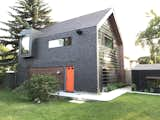 Exterior, Apartment Building Type, Shingles Roof Material, and Green Roof Material West Elevation - Mirror and Hemp Shake Siding  Photos from Calder Laneway House - Edmonton