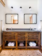 Vintage wood vanity with custom concrete His & Hers sink