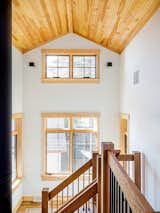 Crisp white walls with shaker style blond wood accents
