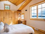 Crisp white bedroom with blond Shaker wood details