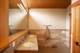 Modern minimalist bathroom with light wood and tile details