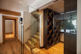 Hallway and Light Hardwood Floor Dark wood wine cellar  Photo 11 of 16 in Hilltop Retreat by Phinney Design Group