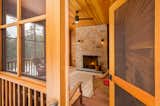 Enclosed screen porch with wood burning fire place