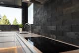 Kitchen cooktop with flush induction stove