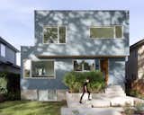 After some deliberations, the clients asked if we could design something that could accommodate their family, aging parent and an in-law suite on the property. They wanted to make sure that every dwelling can have some private outdoor space and privacy. Although the clients wanted a modern aesthetic for the home, it was important for them to make sure the home fit into the existing architectural fabric of the neighbourhood.