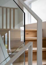 Visibly austere detailing in the home with the sprinkling of colour accents in the fixture and furniture set the mood of the home. The space reads as a bright yet cozy abode for the family to work, play and rest in equal measure.