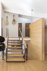 Staircase, Wood Tread, and Metal Railing Split Level Staircase  Photo 3 of 8 in Family Home Transformation by Gettliffe Architecture