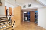 Staircase, Metal Railing, and Wood Tread Split Level Entry  Photo 1 of 8 in Family Home Transformation by Gettliffe Architecture