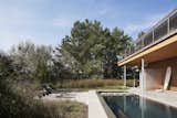 Multiple-award-winning renovation and modest additions to an existing 70's-era beach house at the Jersey Shore integrating a new lap pool and sauna and terraces within a landscape rich in native species linking the site to the adjacent oceanfront dune preserve
