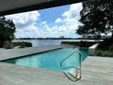 Outdoor, Landscape Lighting, Large Patio, Porch, Deck, Concrete Pools, Tubs, Shower, Large Pools, Tubs, Shower, Trees, Wood Patio, Porch, Deck, Back Yard, Concrete Fences, Wall, and Hardscapes Pool overlooking Pansy Bayou  Photo 7 of 12 in Putterman Residence by Sarasota Architecture