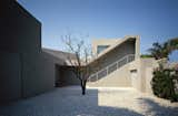 Outdoor, Concrete Fences, Wall, Concrete Patio, Porch, Deck, Side Yard, Landscape Lighting, Walkways, and Hardscapes Inner Courtyard  Photo 9 of 12 in Putterman Residence by Sarasota Architecture