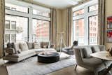 LIVING ROOM: Contemporary and warm with the use of textured fabrics and Italian furniture