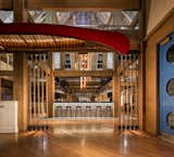 The bar location, under the ‘bell tower,’ provided a 30’ expanse of soaring ceiling to create a Swarovski inspired crew oar sculpture.  Photo 2 of 10 in Boatyard Restaurant by Callin Fortis