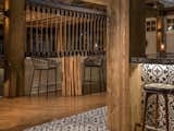 The upscale waterfront theme continues with demising walls of ship rope and steel turnbuckles mortised into the floor.

The bar dies are a porcelain tile to mimic a sailors Moroccan keepsakes.
