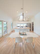 Dining Room, Light Hardwood Floor, Ceiling Lighting, Pendant Lighting, Table, Accent Lighting, Chair, and Stools Interior Living  Photo 4 of 13 in Raccoon Crossing by Terry Wyllie