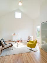 Bedroom, Chair, Storage, Pendant Lighting, Light Hardwood Floor, and Rug Floor Interior Guest Room  Photo 6 of 13 in Raccoon Crossing by Terry Wyllie