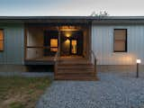 Exterior, Farmhouse Building Type, Concrete Siding Material, Metal Roof Material, Metal Siding Material, Small Home Building Type, Shed RoofLine, House Building Type, and Gable RoofLine Exterior Entry  Photo 8 of 13 in Raccoon Crossing by Terry Wyllie