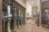 Floor to Ceiling Frames allow for the installation of Wall Series metal wine racks against glass in wine cellars, creating stunning room dividers.