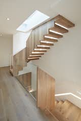 Central Stair at sleeping level, leads down to Living/Dining level and up to Roof Deck.  Photo 1 of 31 in Noe Valley House by IwamotoScott Architecture