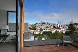 Master Bedroom deck, looking toward St Paul's steeples and Bernal Hill beyond.  Photo 1 of 31 in Noe Valley House by IwamotoScott Architecture