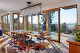Upstairs dining; live edge table from Wane + Flitch, chandelier by Nick Alain. 