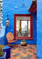 Front entry. Gas lamp from Bevolo. Stained glass tree reclaimed from tear down in Los Angeles. Arto tile. Vintage chair. 