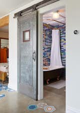 Found elevator door in New Orleans, restored and built barn door track. 