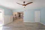 The family room featuring a  Minka Aire ceiling fan